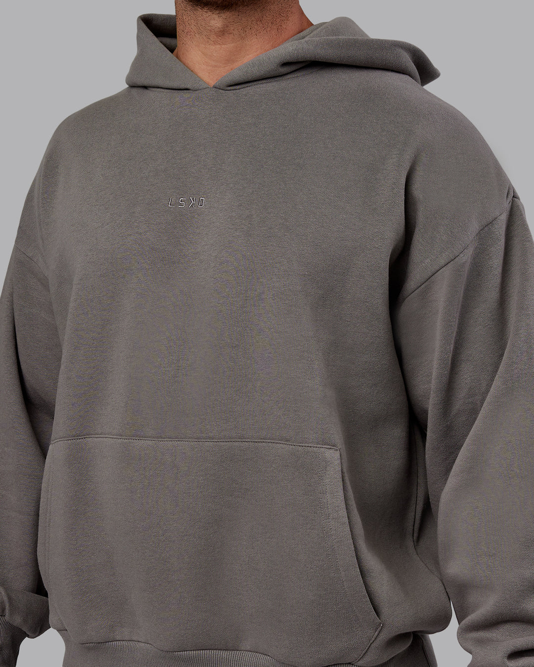 Man wearing Unisex MVP Hoodie Oversize - Storm Front - view 10
