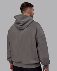 Man wearing Unisex MVP Hoodie Oversize - Storm Front | Thumbnail Index: 4