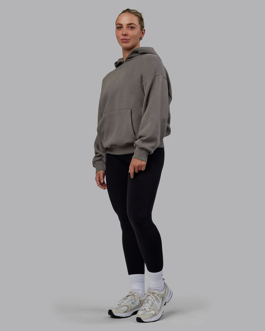 Woman wearing Unisex MVP Hoodie Oversize - Storm Front - view 7
