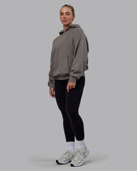 Woman wearing Unisex MVP Hoodie Oversize - Storm Front | Thumbnail Index: 6