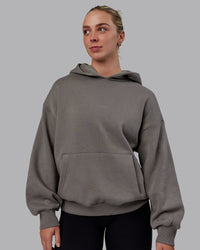 Woman wearing Unisex MVP Hoodie Oversize - Storm Front | Thumbnail Index: 1