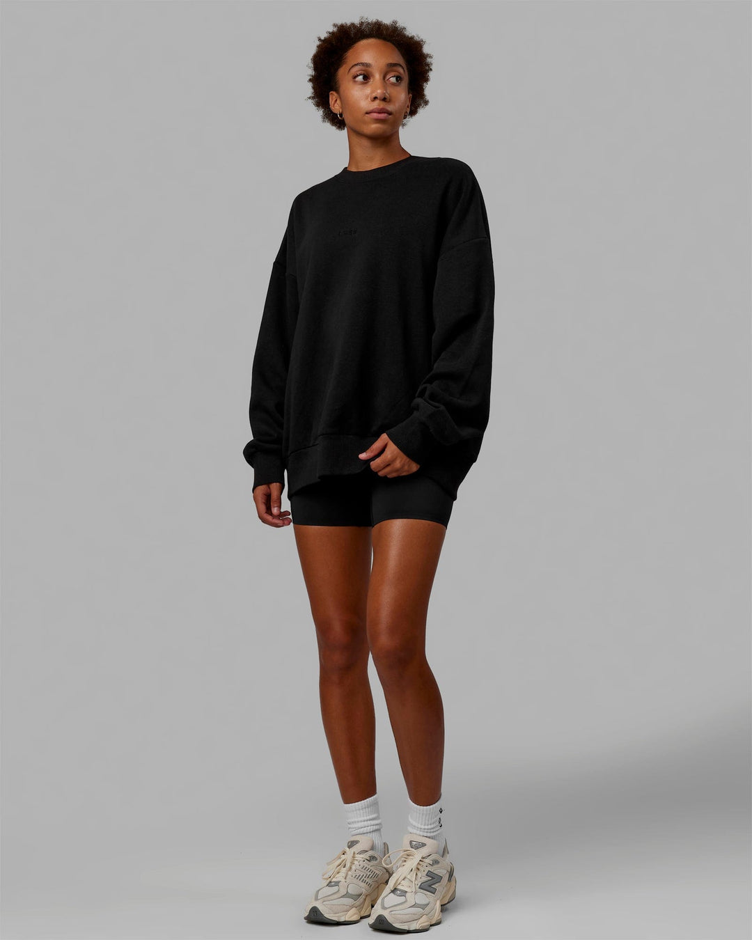 Woman wearing Unisex MVP Sweater Oversize - Black - view 5