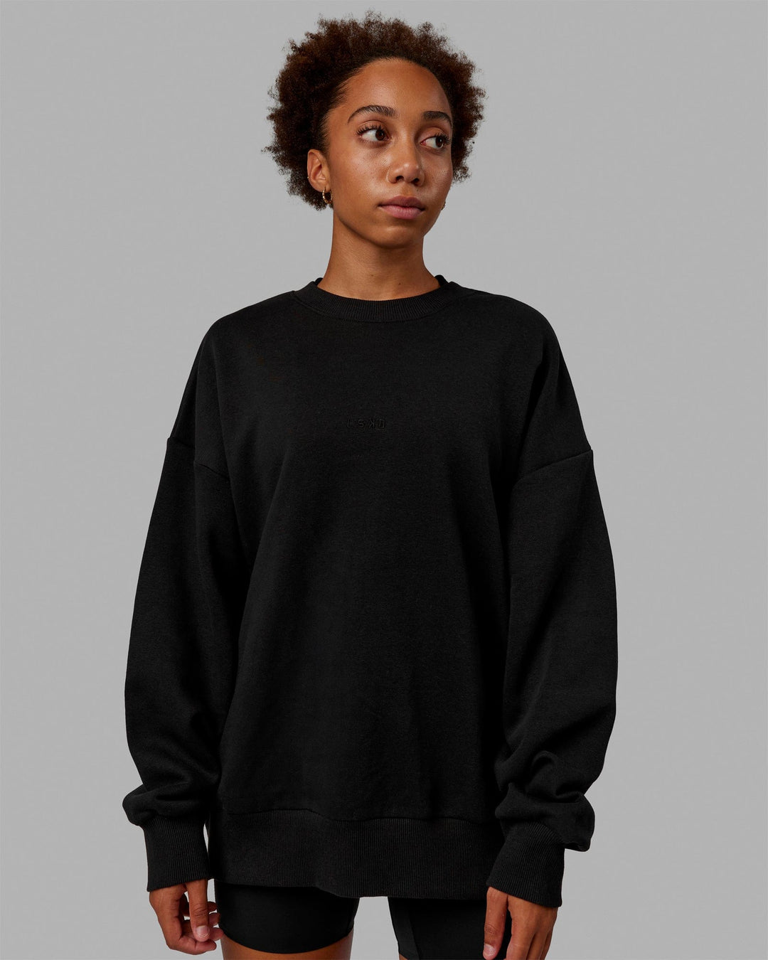 Woman wearing Unisex MVP Sweater Oversize - Black - view 3