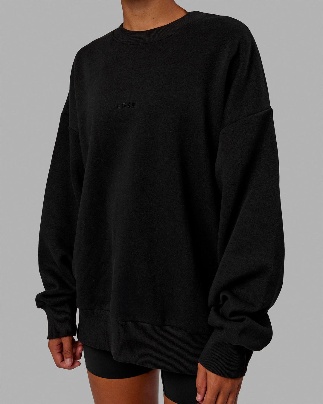 Woman wearing Unisex MVP Sweater Oversize - Black - view 9