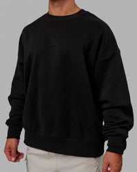 Man wearing Unisex MVP Sweater Oversize - Black | Thumbnail Index: 11