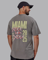 Man wearing Unisex Miami25 Washed FLXCotton Tee Oversize - Storm Front-Lemon Fizz | Thumbnail Index: 10