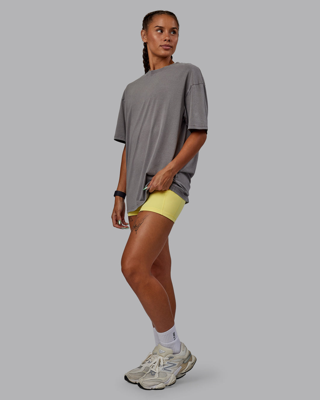 Woman wearing Unisex Miami25 Washed FLXCotton Tee Oversize - Storm Front-Lemon Fizz - view 12