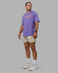Man wearing Unisex Motion FLXCotton Tee Oversize - Dahlia Purple-Vibrant Orange | Thumbnail Index: 9