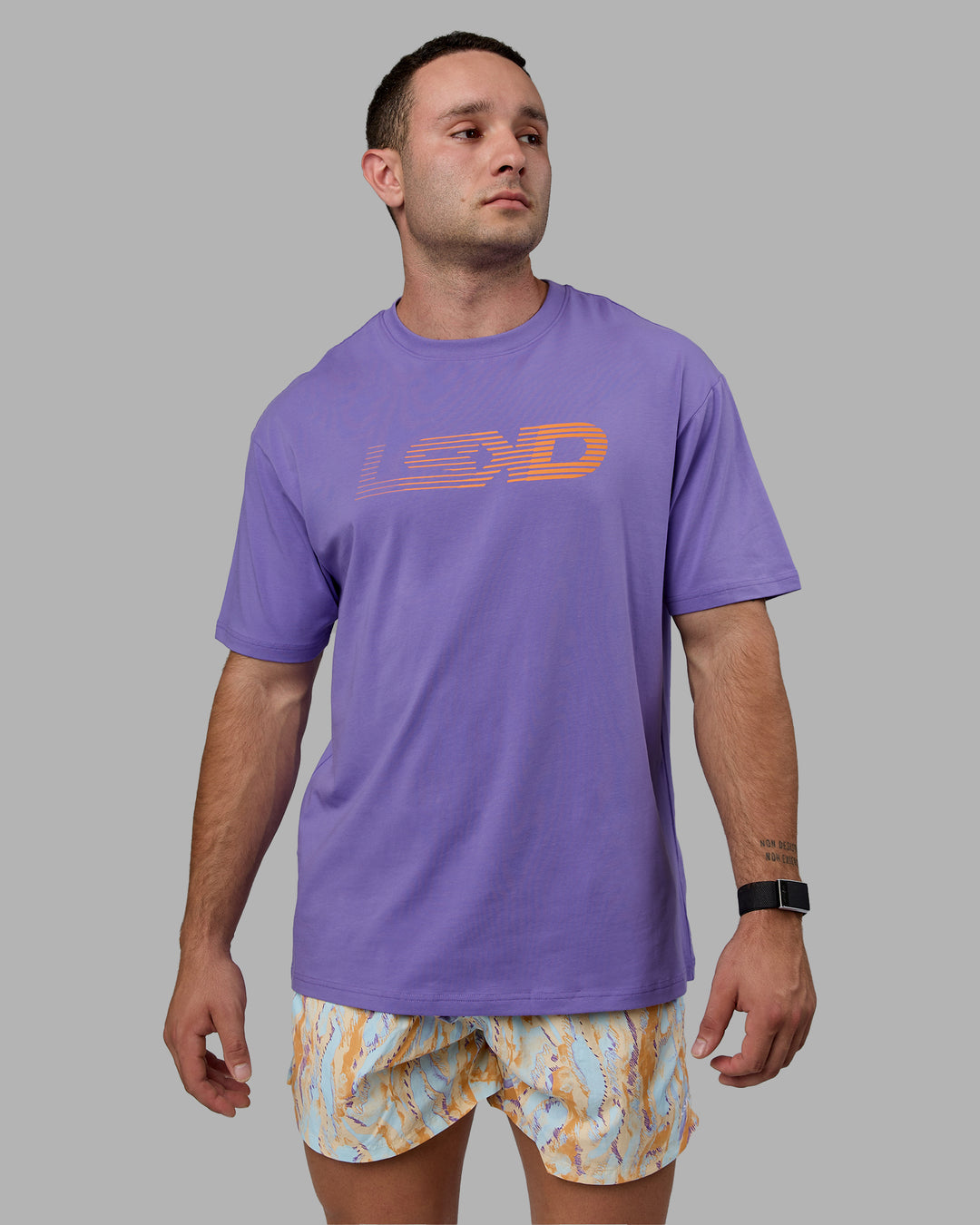 Man wearing Unisex Motion FLXCotton Tee Oversize - Dahlia Purple-Vibrant Orange - view 3