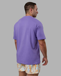 Man wearing Unisex Motion FLXCotton Tee Oversize - Dahlia Purple-Vibrant Orange | Thumbnail Index: 3