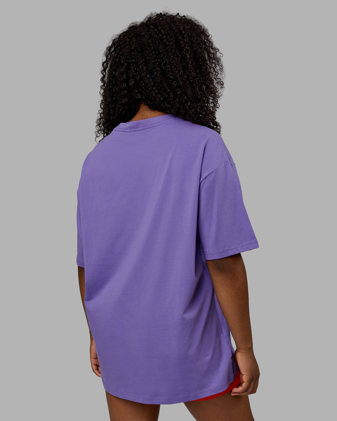 Woman wearing Unisex Motion FLXCotton Tee Oversize - Dahlia Purple-Vibrant Orange - view 8