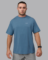 Man wearing Unisex Move Fast Value Series FLXCotton Tee Oversize - Elemental Blue-Off White | Thumbnail Index: 3
