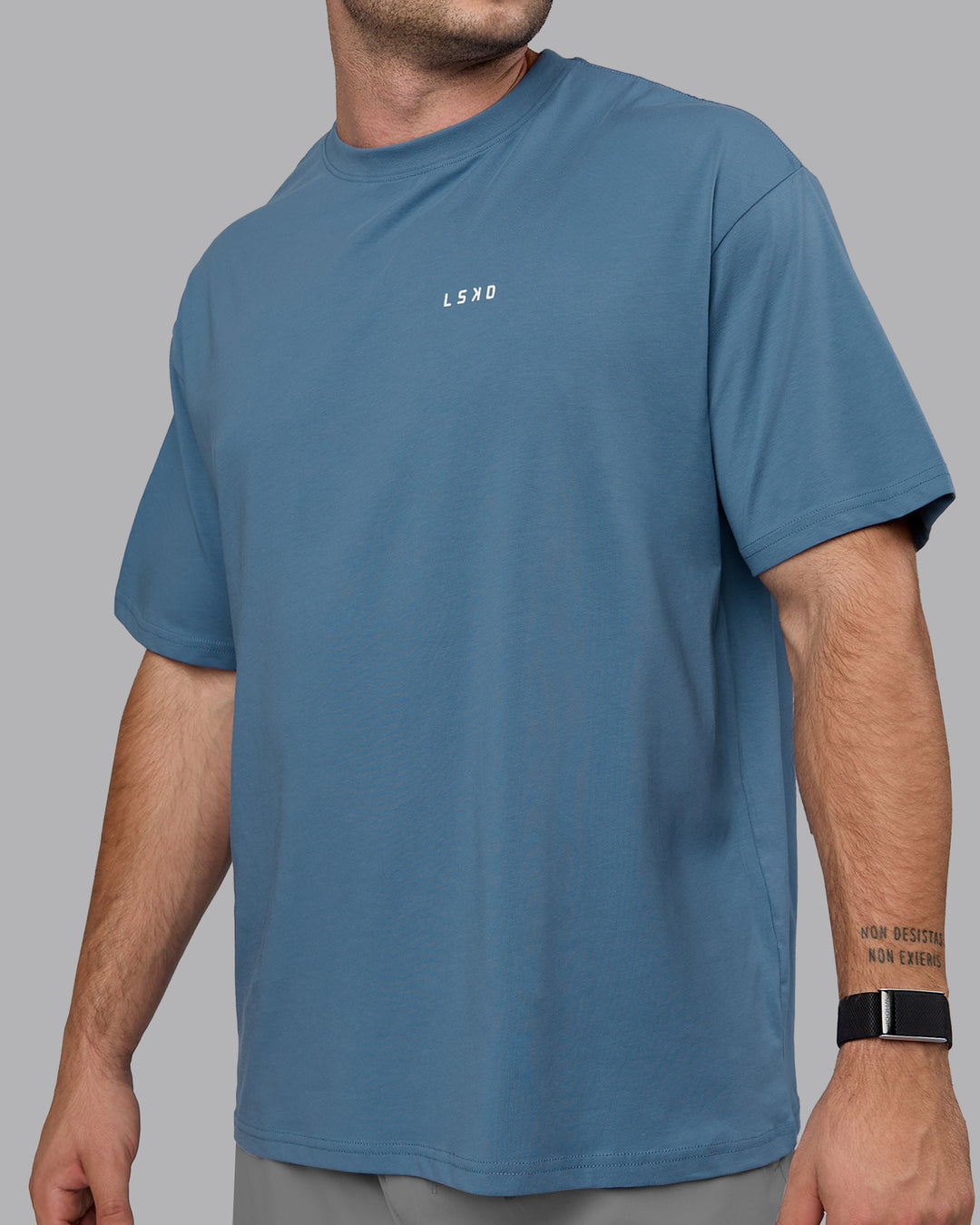Man wearing Unisex Move Fast Value Series FLXCotton Tee Oversize - Elemental Blue-Off White - view 9