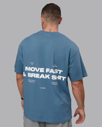 Man wearing Unisex Move Fast Value Series FLXCotton Tee Oversize - Elemental Blue-Off White | Thumbnail Index: 1