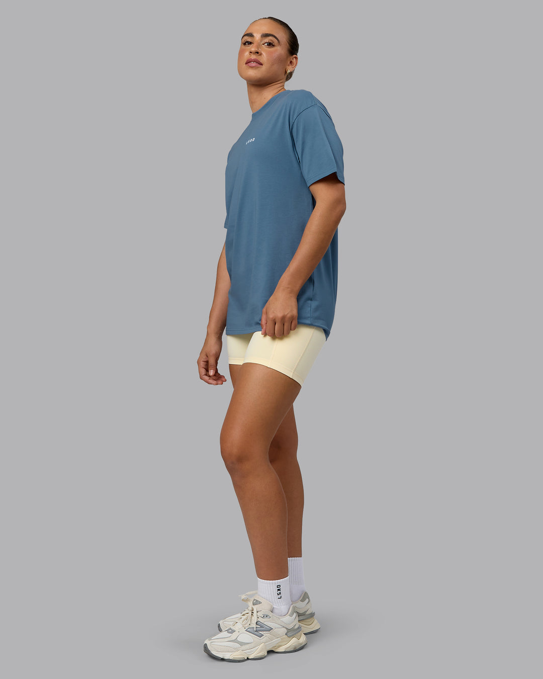Woman wearing Unisex Move Fast Value Series FLXCotton Tee Oversize - Elemental Blue-Off White - view 5