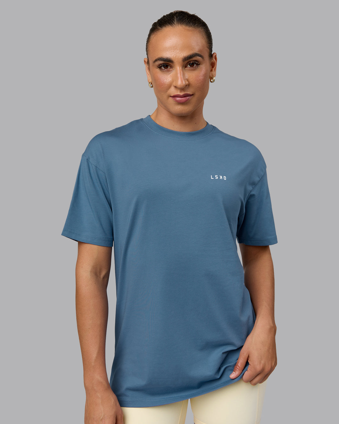 Woman wearing Unisex Move Fast Value Series FLXCotton Tee Oversize - Elemental Blue-Off White - view 3