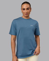 Woman wearing Unisex Move Fast Value Series FLXCotton Tee Oversize - Elemental Blue-Off White | Thumbnail Index: 2