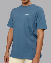 Woman wearing Unisex Move Fast Value Series FLXCotton Tee Oversize - Elemental Blue-Off White | Thumbnail Index: 7