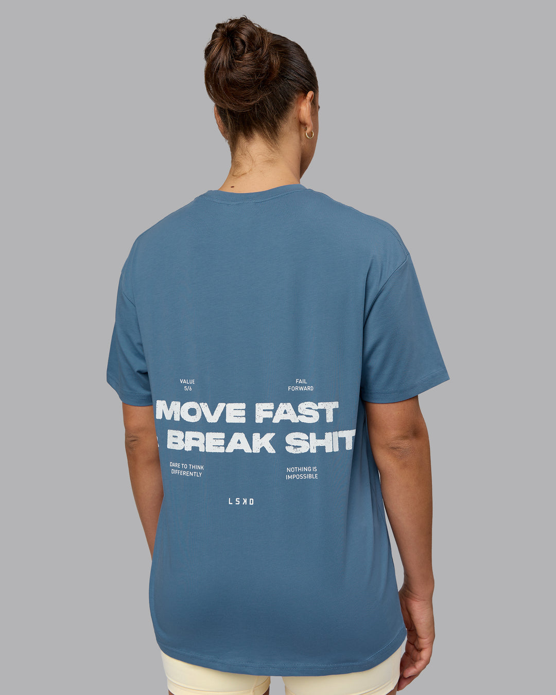 Woman wearing Unisex Move Fast Value Series FLXCotton Tee Oversize - Elemental Blue-Off White - view 7