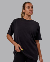 Woman wearing Unisex Washed Pressure Heavyweight Tee Oversize - Black-White | Thumbnail Index: 4