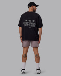 Man wearing Unisex Washed Pressure Heavyweight Tee Oversize - Black-White | Thumbnail Index: 11
