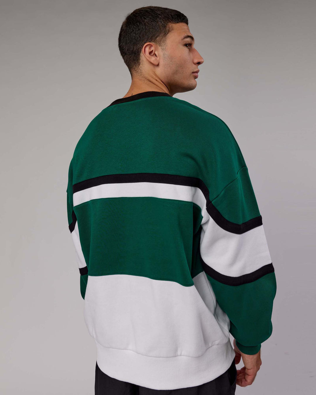 Man wearing Unisex PrimeTime Sweater Oversize - Malachite-White - view 4