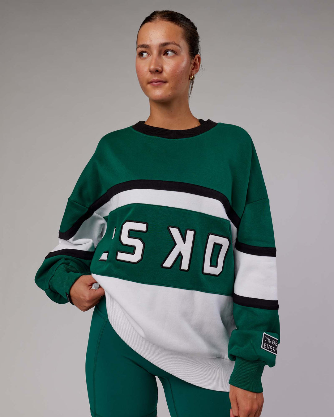 Woman wearing Unisex PrimeTime Sweater Oversize - Malachite-White - view 5
