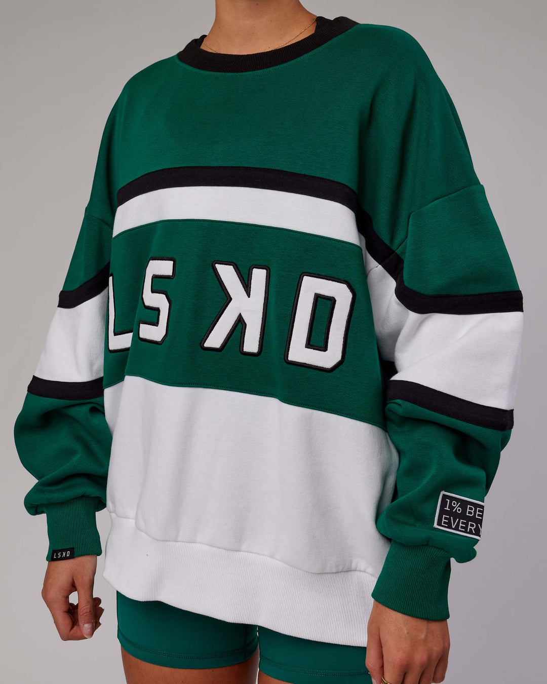 Woman wearing Unisex PrimeTime Sweater Oversize - Malachite-White - view 7