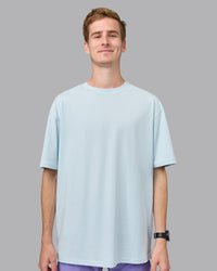 Man wearing Unisex Push Boundaries FLXCotton Tee Oversize - Light Cyan-White | Thumbnail Index: 2