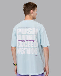 Man wearing Unisex Push Boundaries FLXCotton Tee Oversize - Light Cyan-White | Thumbnail Index: 6