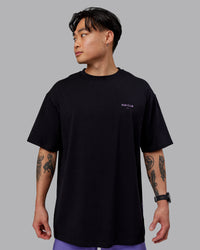 Man wearing Unisex RUN CLUB FLXCotton Tee Oversize - Black-Purple Swirl | Thumbnail Index: 2