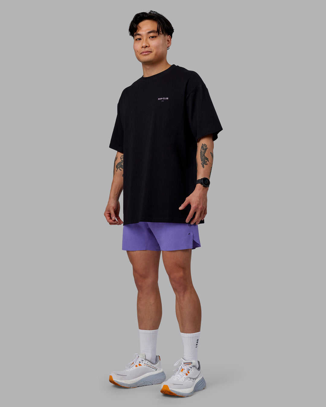 Man wearing Unisex RUN CLUB FLXCotton Tee Oversize - Black-Purple Swirl - view 6
