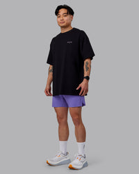 Man wearing Unisex RUN CLUB FLXCotton Tee Oversize - Black-Purple Swirl | Thumbnail Index: 5