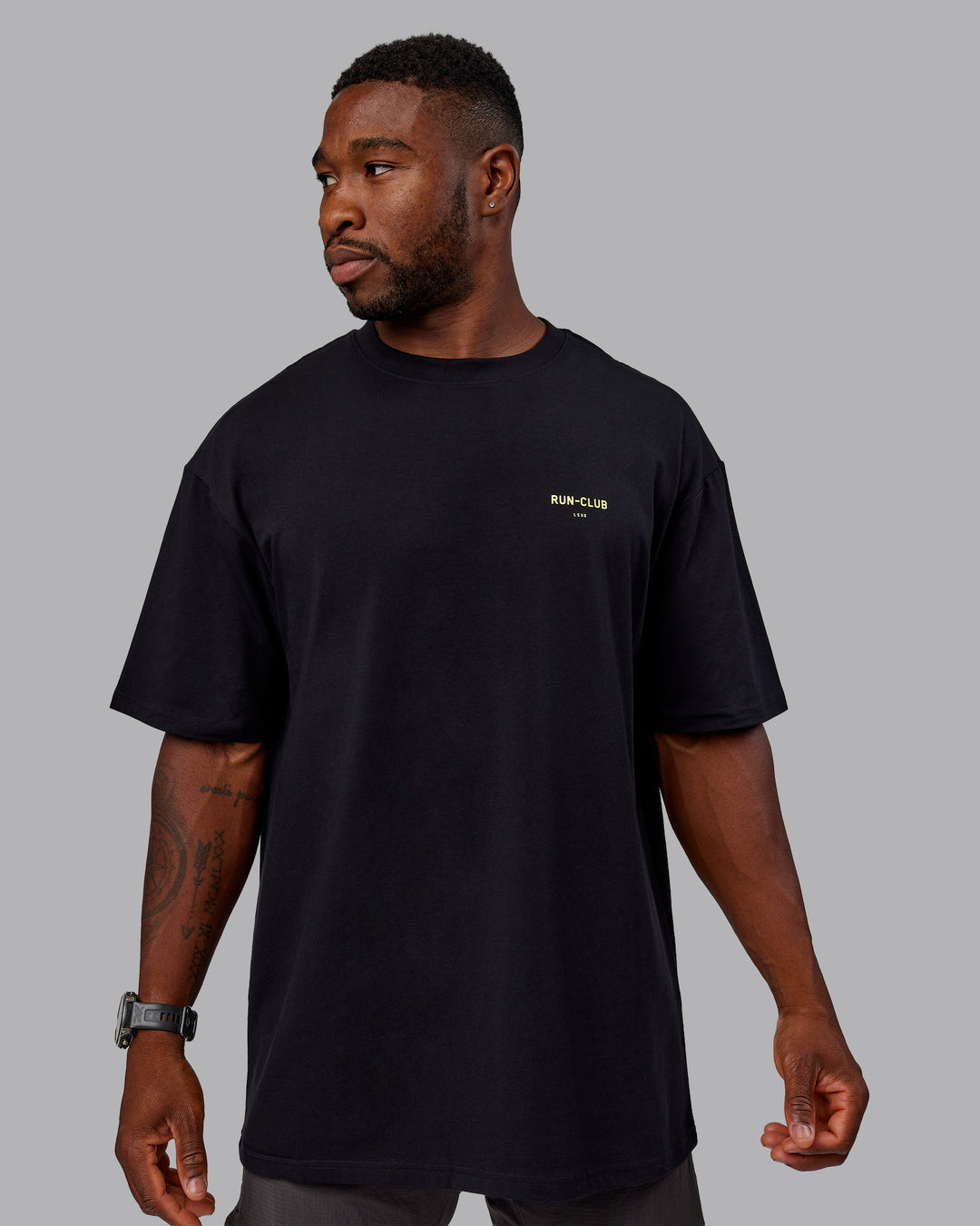 Man wearing Unisex RUN CLUB FLXCotton Tee Oversize - Black-Vol - view 3