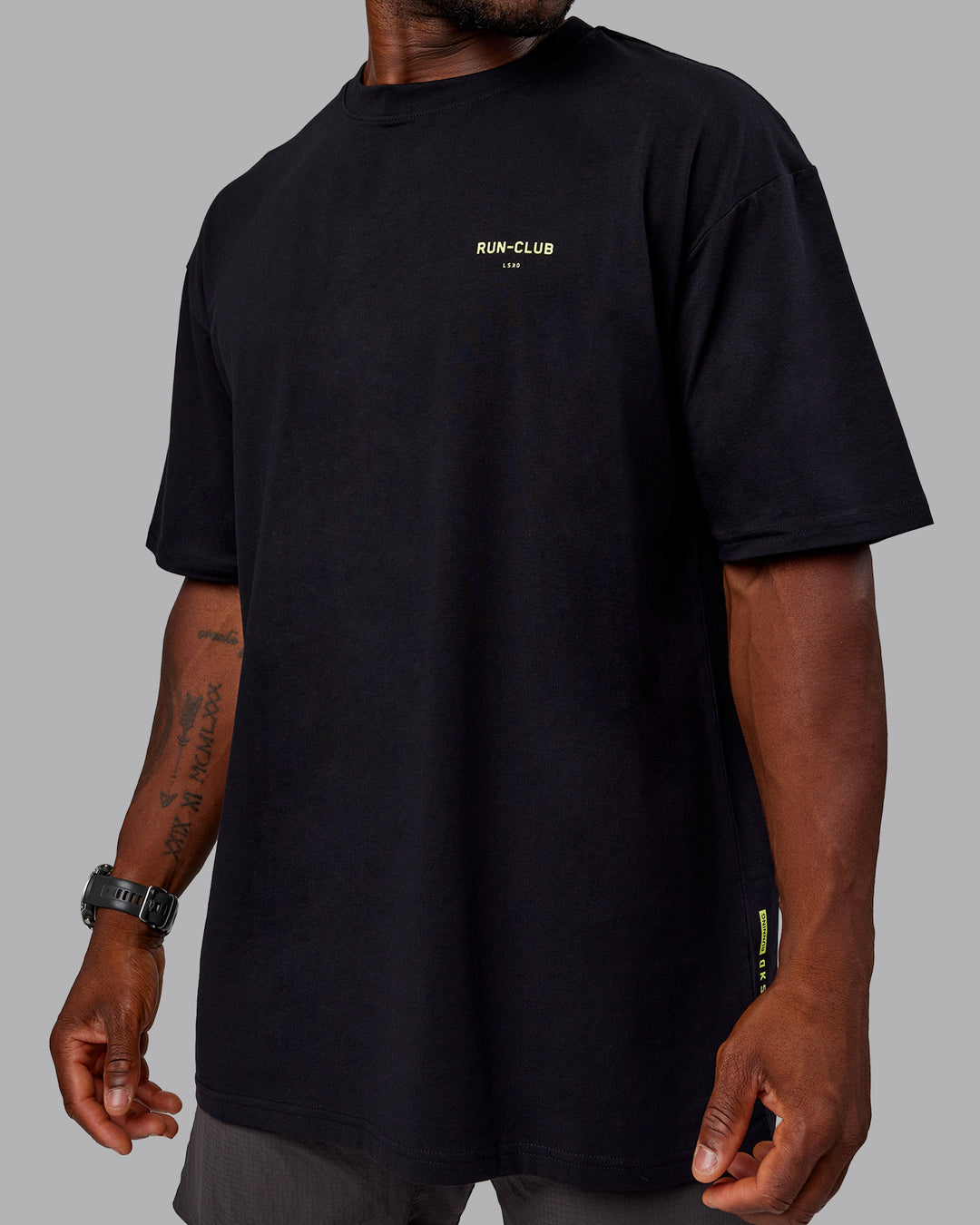 Man wearing Unisex RUN CLUB FLXCotton Tee Oversize - Black-Vol - view 11