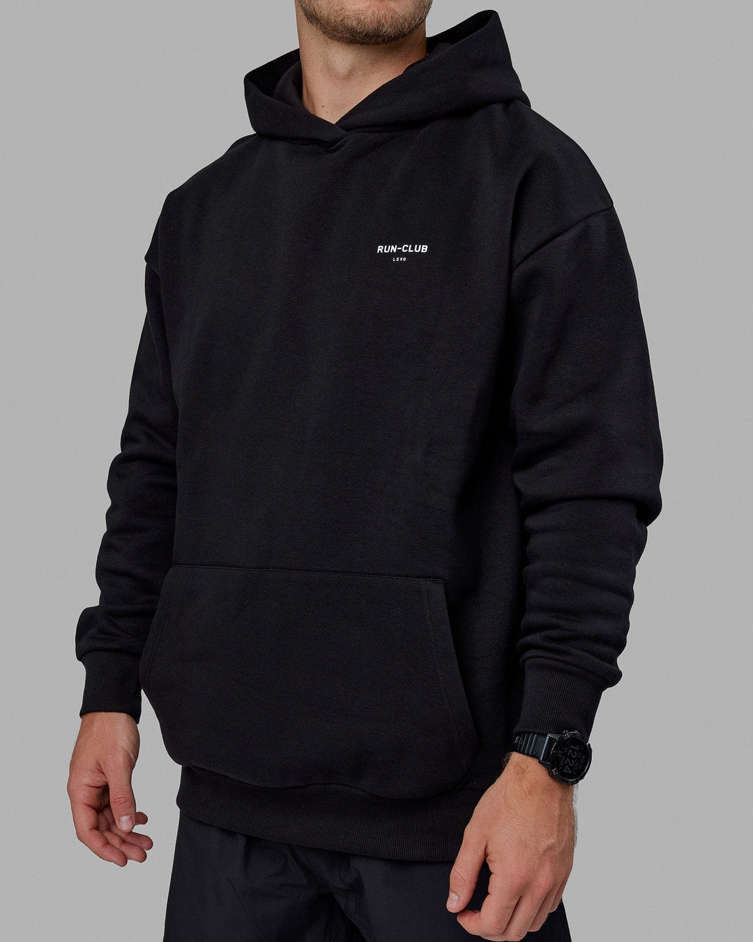 Man wearing Unisex RUN-CLUB Hoodie Oversize - Black - view 10