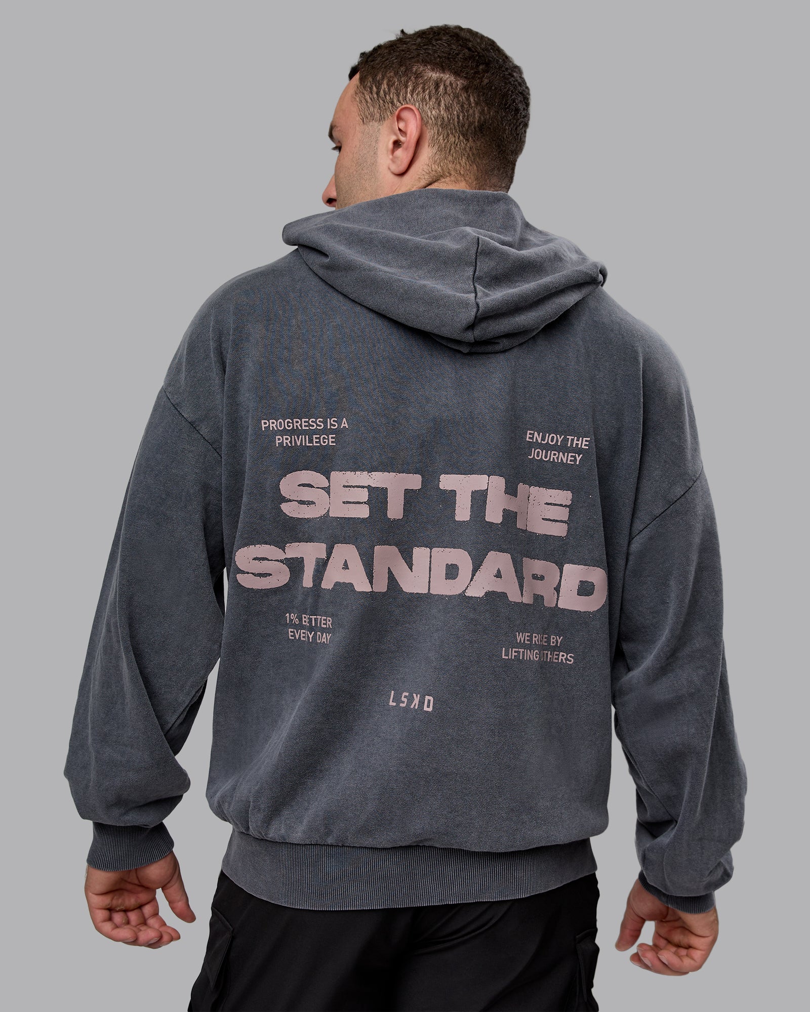 Man wearing Unisex Washed Set the Standard Hoodie Oversize - Black-Greyish Purple