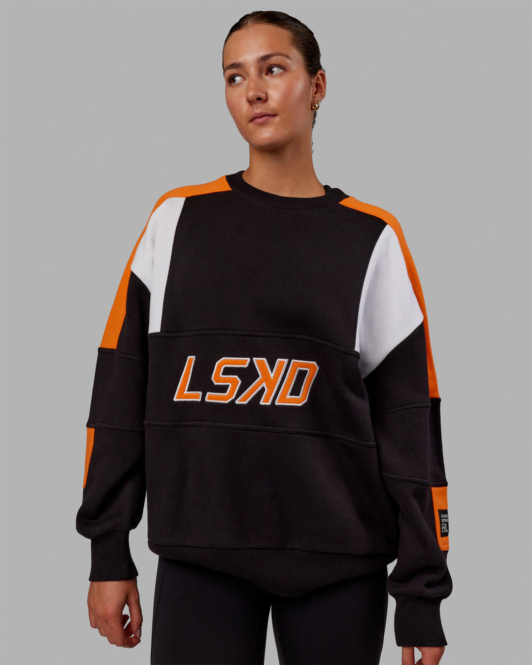 Woman wearing Unisex Slam Sweater Oversize - Black-Ultra Orange - view 2