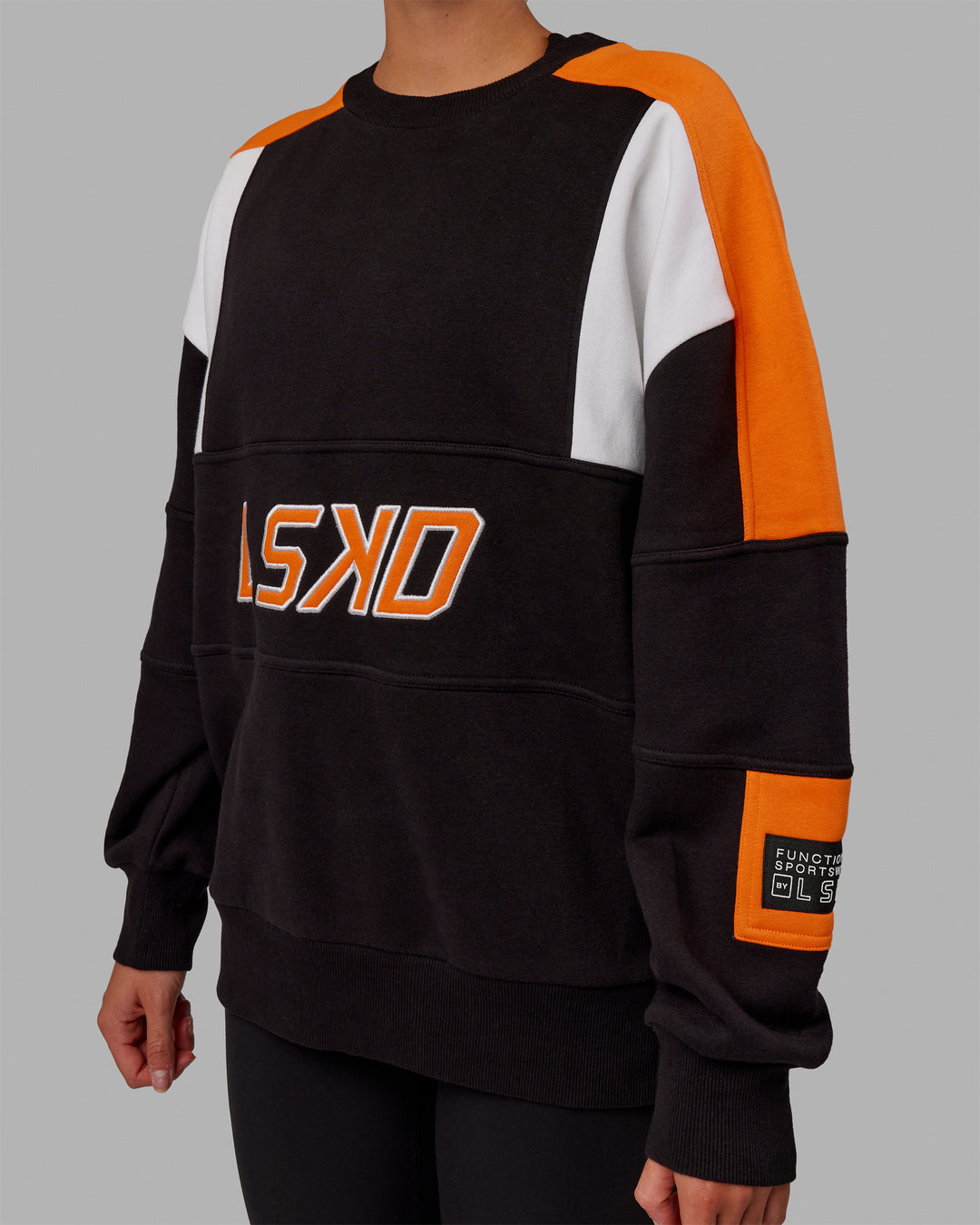 Woman wearing Unisex Slam Sweater Oversize - Black-Ultra Orange - view 7