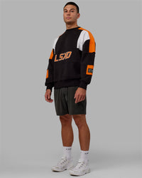 Man wearing Unisex Slam Sweater Oversize - Black-Ultra Orange | Thumbnail Index: 9
