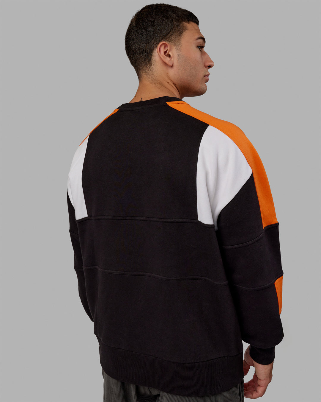 Man wearing Unisex Slam Sweater Oversize - Black-Ultra Orange - view 4