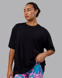 Woman wearing Unisex So Cal 24 FLXCotton Tee Oversize - Black-Beacon Orange | Thumbnail Index: 3