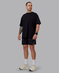 Man wearing Unisex So Cal 24 FLXCotton Tee Oversize - Black-Beacon Orange | Thumbnail Index: 10