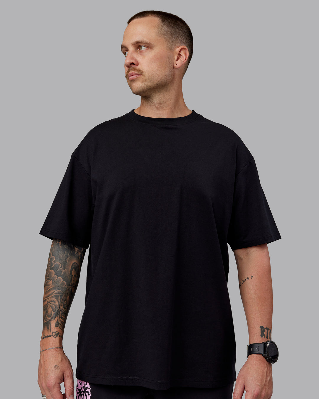 Man wearing Unisex So Cal 24 FLXCotton Tee Oversize - Black-Beacon Orange - view 3
