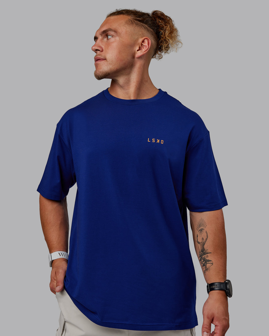 Man wearing Unisex Strike Through FLXCotton Tee Oversize - Midnight Blue-Vibrant Orange - view 6