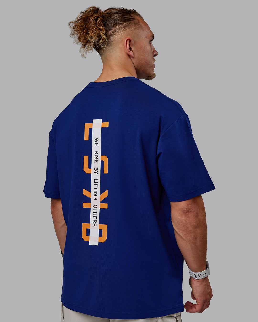 Man wearing Unisex Strike Through FLXCotton Tee Oversize - Midnight Blue-Vibrant Orange - view 2