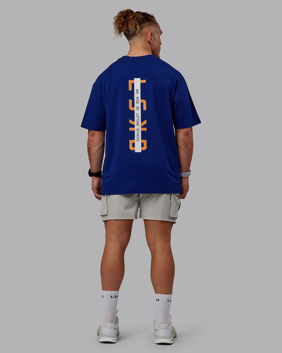 Man wearing Unisex Strike Through FLXCotton Tee Oversize - Midnight Blue-Vibrant Orange - view 12