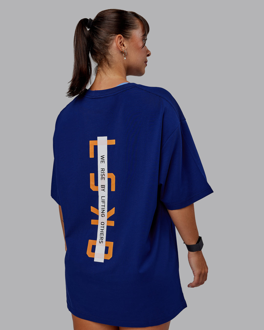 Woman wearing Unisex Strike Through FLXCotton Tee Oversize - Midnight Blue-Vibrant Orange - view 7