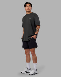 Man wearing Unisex Strike Through FLXCotton Tee Oversize - Pirate Black-Black | Thumbnail Index: 5