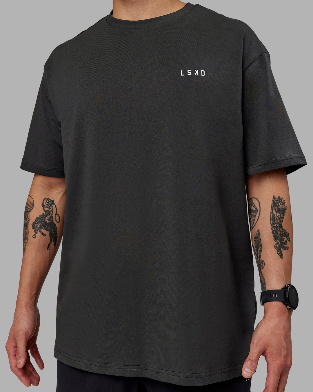 Man wearing Unisex Strike Through FLXCotton Tee Oversize - Pirate Black-Black - view 8